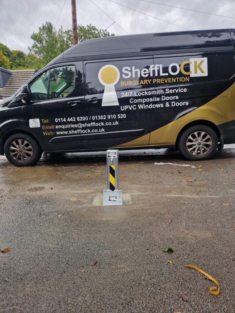 A SheffLOCK branded van parked outside new telescopic bollards installation